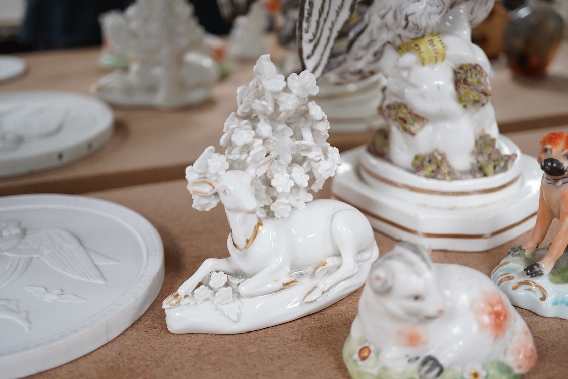 A rare Staffordshire porcelain model of an eagle or vulture, c.1830-50, and five Derby porcelain models, 1810–30; two recumbent sheep, a pug dog, a deer and a dove, 20cm high